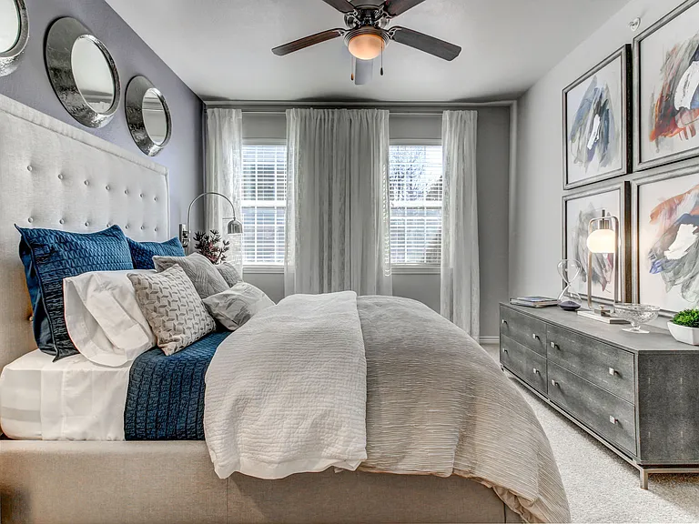 Spacious bedroom with natural light.