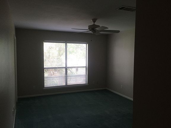 Master Bdrm; lake view; balcony access, ceiling fan