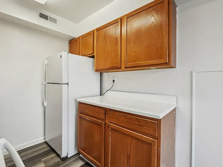 Explore this inviting kitchen space with ample storage and a clean, modern design.