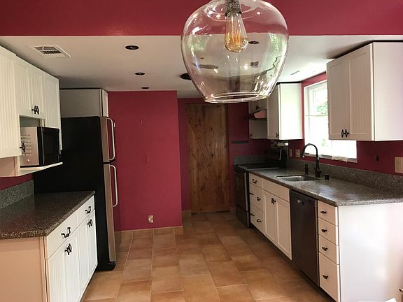 Kitchen. The laundry room is behind the sliding barn door.