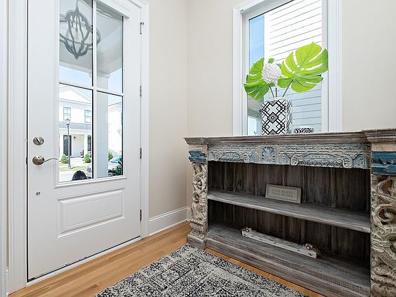 Front entry upon entering the front of the home from the large inviting outdoor porch