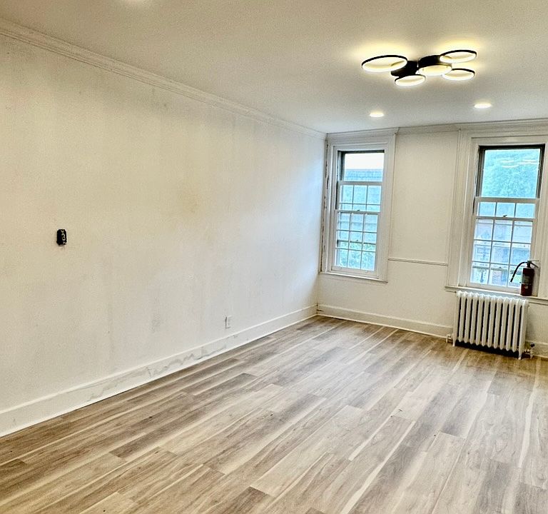 Living Room ~ with large windows overlooking High Street.