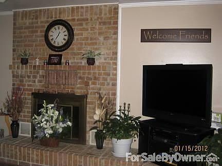 Entrance to living area
						:
						woodburning fireplace