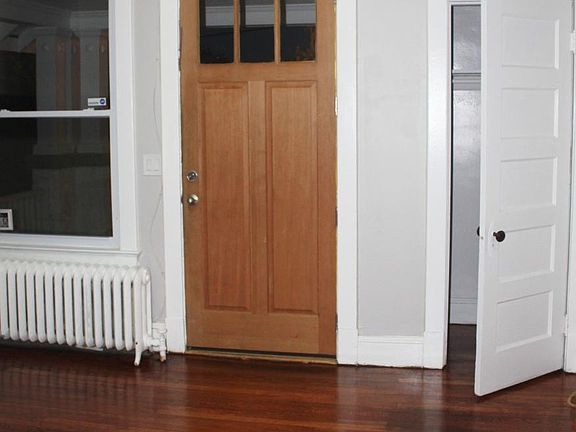 Front entrance/living room with coat closet