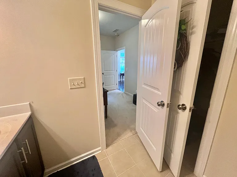 Larger walk-in closet behind the door