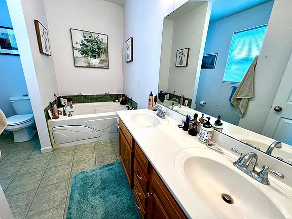Master bath with shower and large tub.