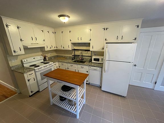 Spacious kitchen: 
granite counter tops, island, stove/frig, microwave, dishwasher