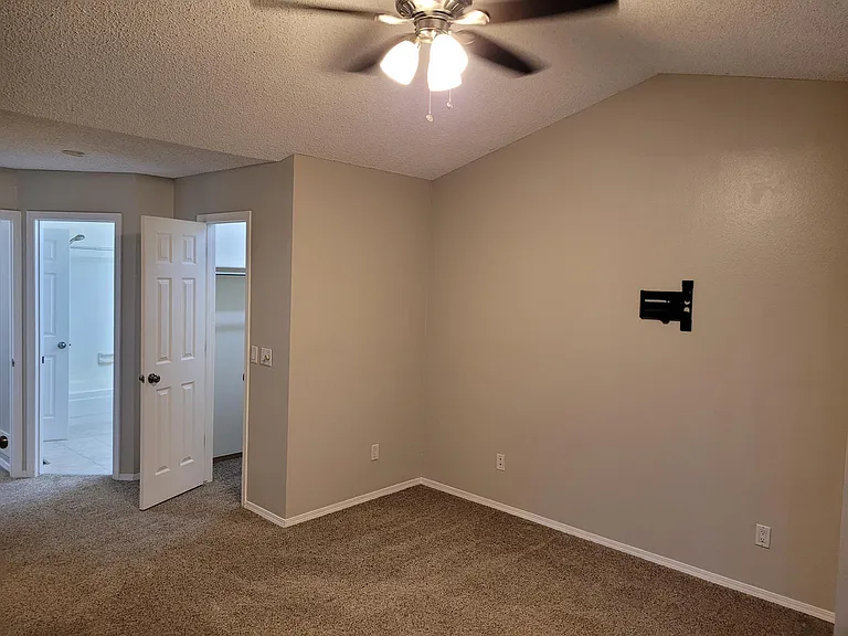 Master bedroom with walk in-in closet and bathroom access