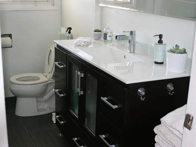 Main bath with tub and separate shower.