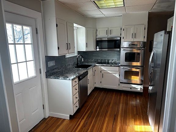 Brand new granite, cabinet doors, sink & cooktop