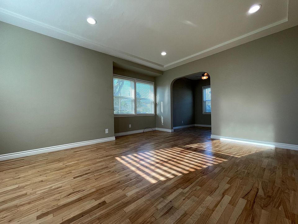 Living room with hardwood floor and recess lights