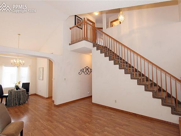 Gorgeous pergo flooring, vaulted ceilings and arched entry for a timeless look.