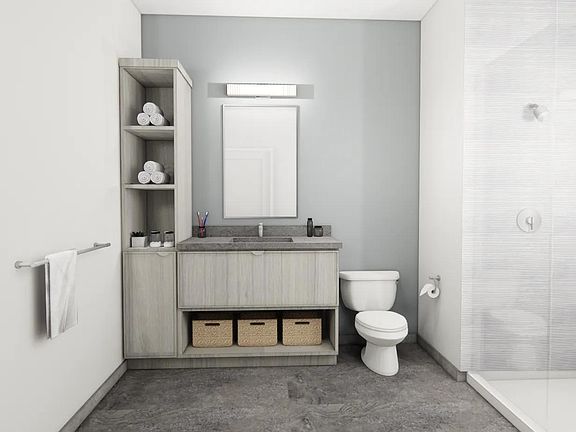 Designer bathrooms with double vanities, quartz countertops, and linen closet in select apartment homes near Boston.