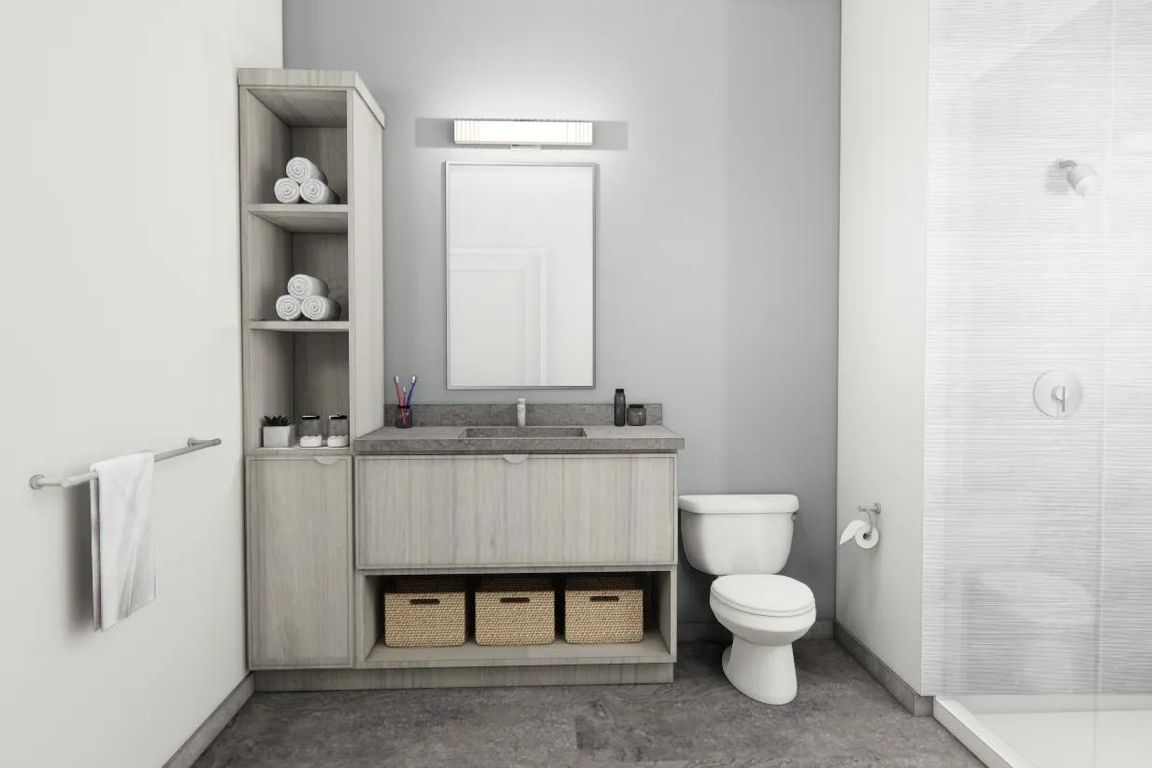 Designer bathrooms with double vanities, quartz countertops, and linen closet in select apartment homes near Boston.