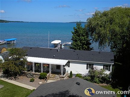 Elk Lake 100ft pure sand beach.