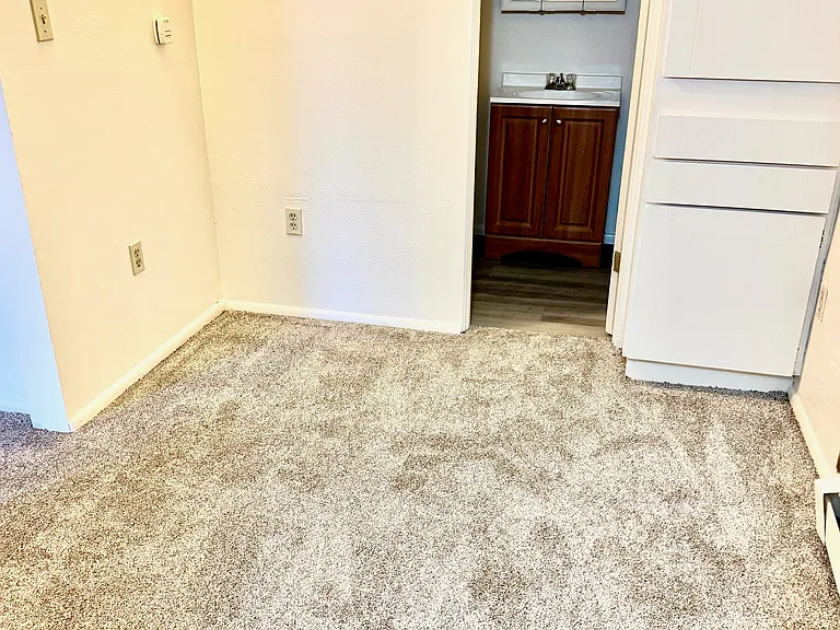 Hall with entranace to the full bathroom