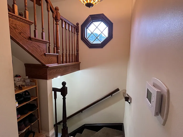 Front entry way - dedicated separate entry for Unit 2 with indoor stairs coming up to the 2nd floor. Space for a shoe rack and deep coat closet next to it.