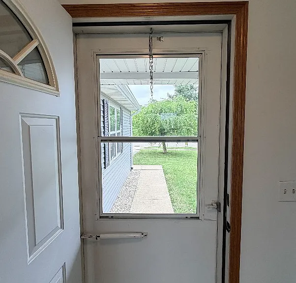 Front entrance door and view of street