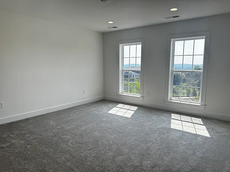 Spacious master bedroom with adequate ventilation on top floor