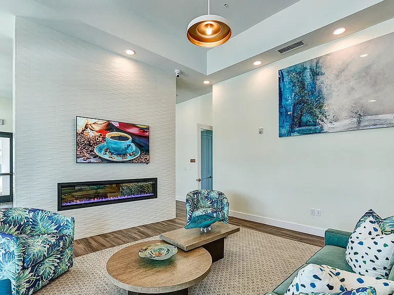 Imperial Crossing Luxury Apartment Homes community clubhouse seating area.