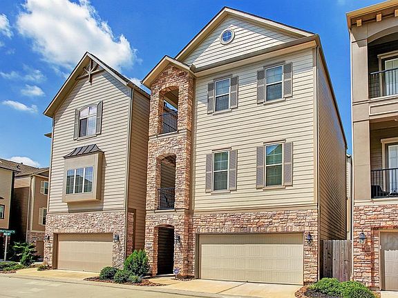 The rock facade and style is one of its kind in the community. It has back and side yards across from the park fountain and near the dog park.