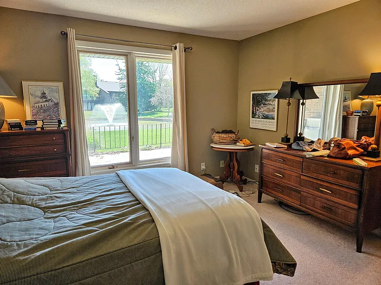 Primary bedroom with pond view