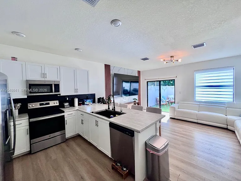 10939 W 32nd Ln — Photo 6