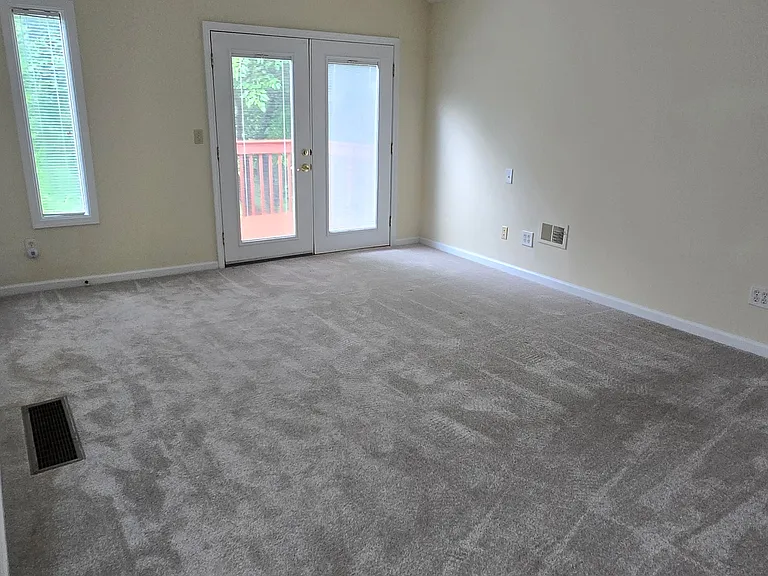 Upstairs master suite with cathedral ceiling and small deck