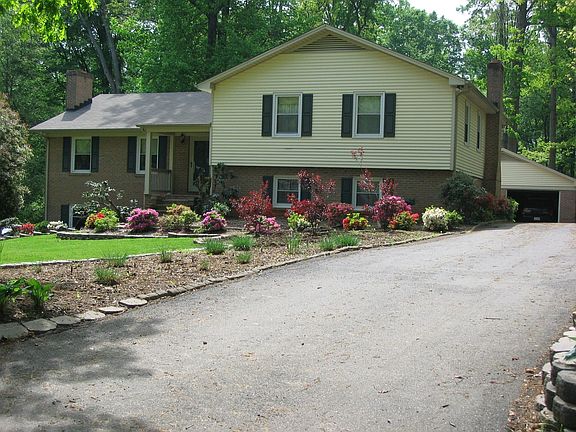 paved driveway with 2 car garage