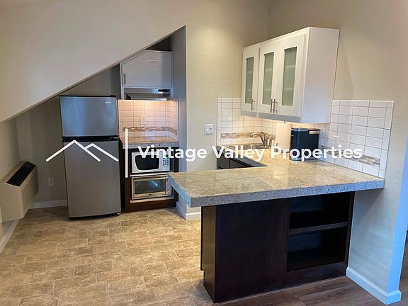 Kitchenette with eat-in bar area.