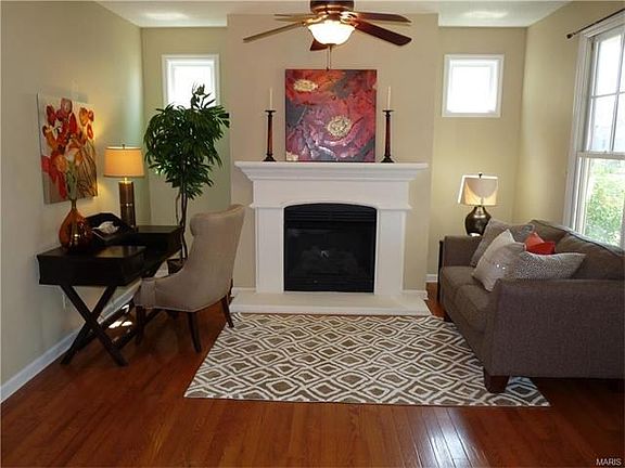 Living room features gas fireplace and lots of natural light!