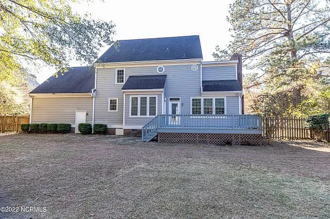 Fully fenced-in backyard for family or pets.