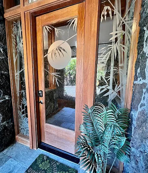 The beautiful bamboo etched glass front door.