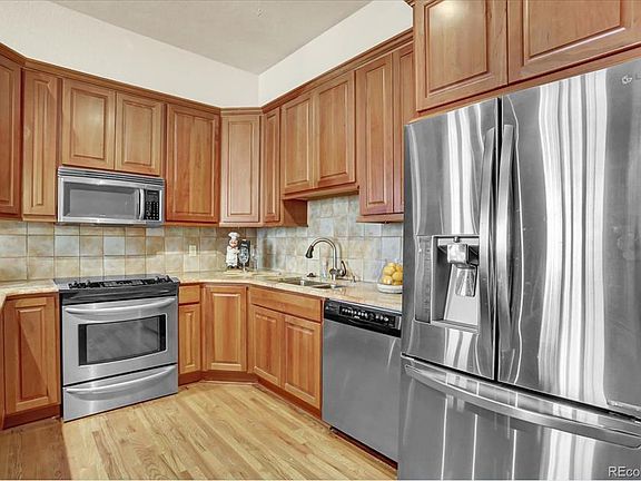 Stainless appliances, pull outs, two corner lazy susan cabinets, 42 inch upper cabinets