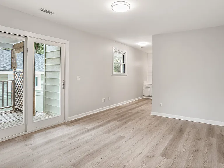 Master Bedroom w/ sliding glass door access to rear covered deck