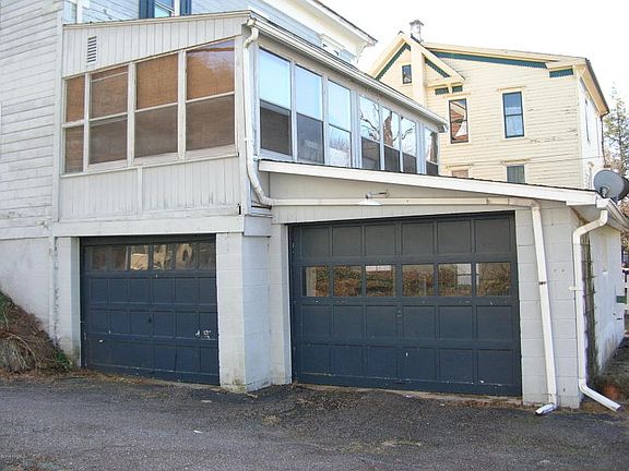 NORTH SIDE WITH DOUBLE GARAGE AND ENCLOSED PORCH