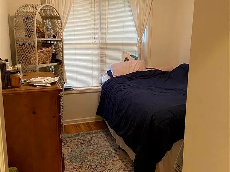 This bedroom gets plenty of light and has enough room for a double or a queen bed.