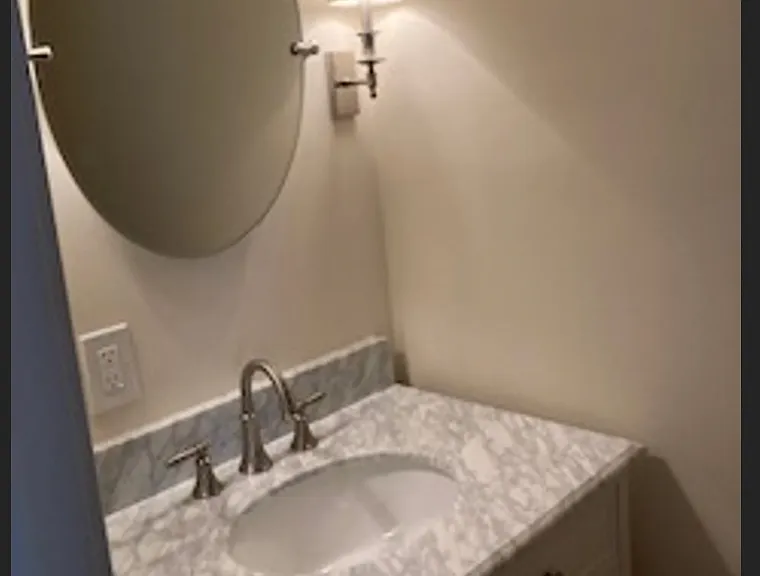 Powder room/half bath, convenient to BR2.