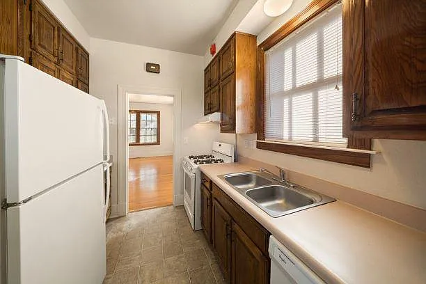 Galley Style Kitchen with beautiful wood cabinets.