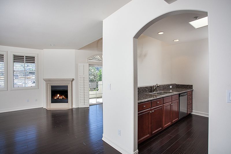 The kitchen is open to the dining area and to the living room (plus view of the balcony)