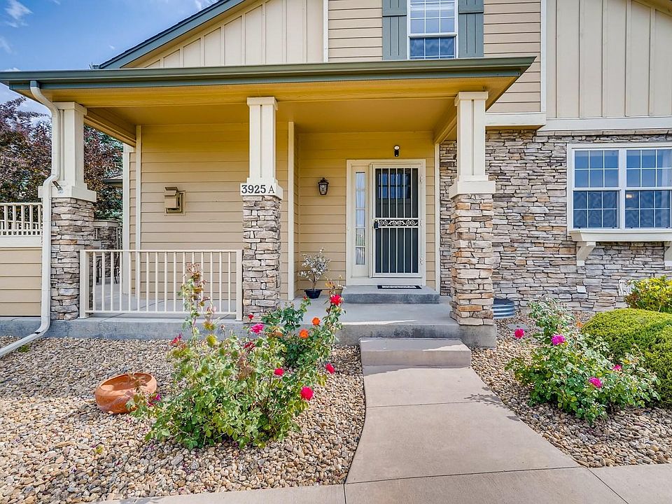 This is an end unit, beautifully landscaped, facing Legacy Ridge golf course