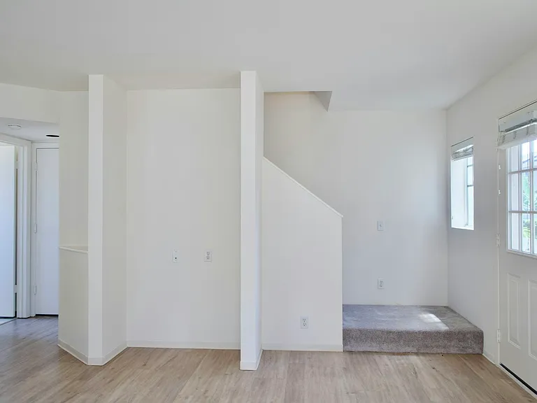 Living Room View to Garage or Upstairs
