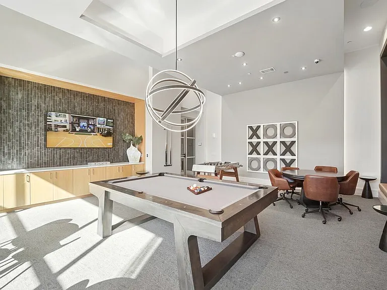 Game room with billiards and foosball