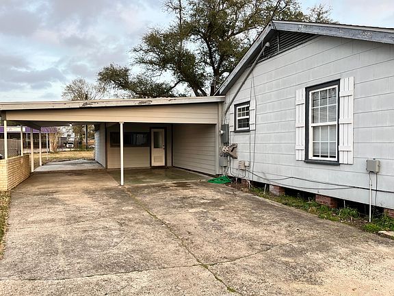 Carport, which has lots of room for outdoor furniture towards the back.
