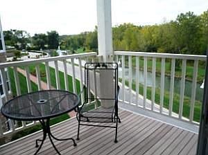 Balcony overlooking woods, water & fountains