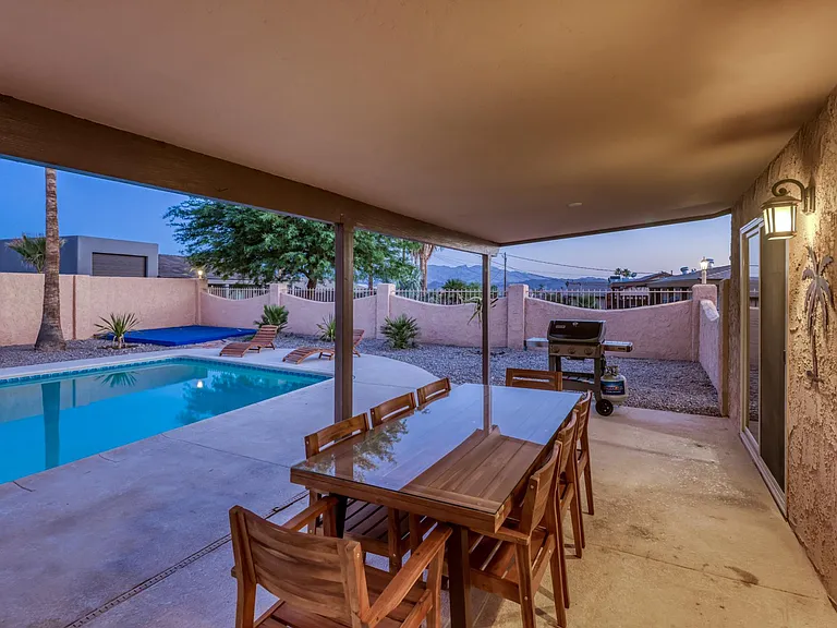 Spacious covered patio with outdoor dining area _ perfect for gatherings year-round.