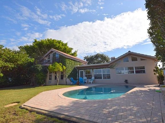 Nice Pool with lots of yard left over for the kids or pets to play.