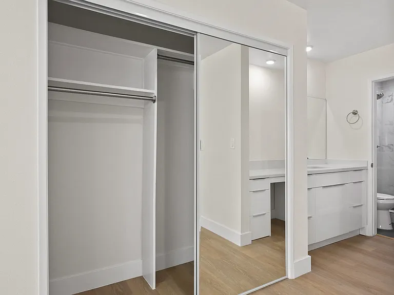 -Size Closet and Bathroom with Walk-In Shower