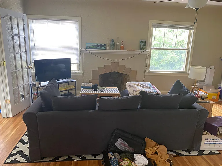 Living room with view of fireplace.
