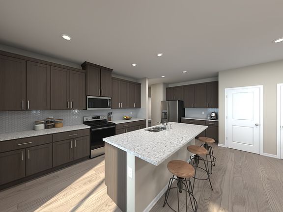 The Harrison s well-appointed kitchen with a large island makes meal prep a breeze.